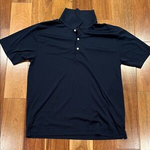 Used navy polo shirt. Polyester material. Nice athletic feel.